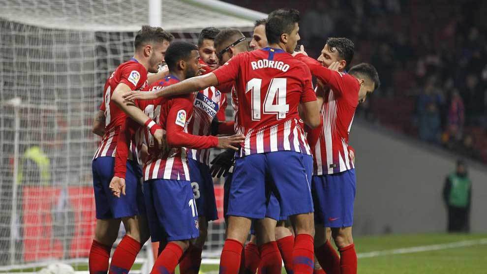Atletico Madrid&apos;s players celebrate a goal.