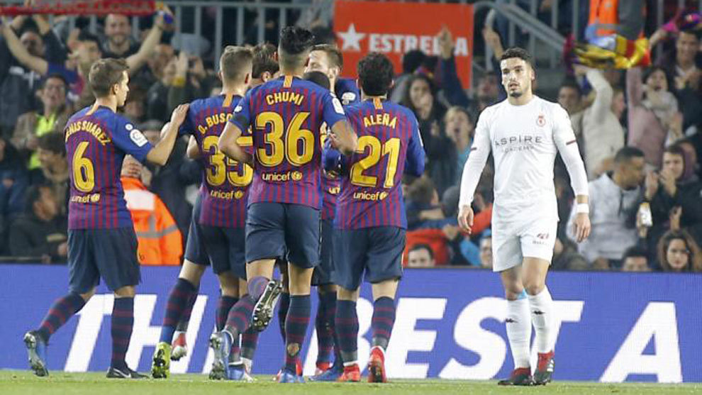 Barcelona&apos;s players celebrate a goal.