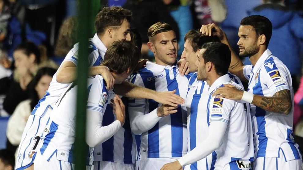 Real Sociedad&apos;s players celebrate a goal.