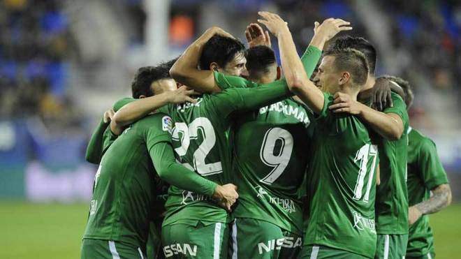 Sporting&apos;s players celebrate a goal.