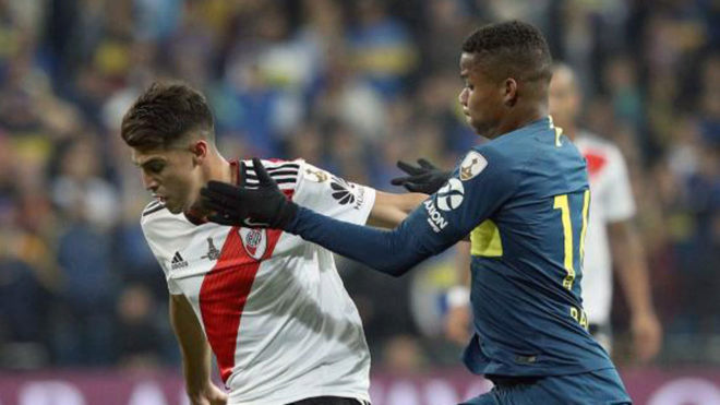 Exequiel Palacios is challenged by Wilmar Barrios during the second...