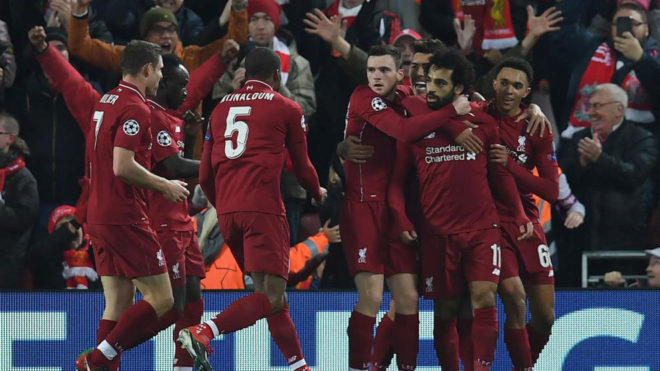 Liverpool&apos;s players celebrate the goal.
