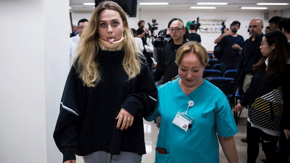 Sophia Floersch reacts as she leaves a press conference at a hospital...