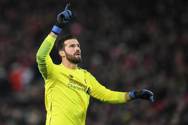 Liverpool&apos;s Brazilian goalkeeper Alisson Becker gestures during the...