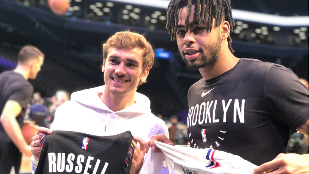 Antoine Griezmann with D&apos;Angelo Russell.