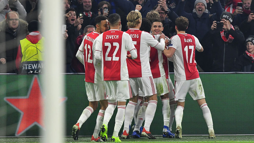 The Ajax players celebrate scoring a goal in the Champions League.