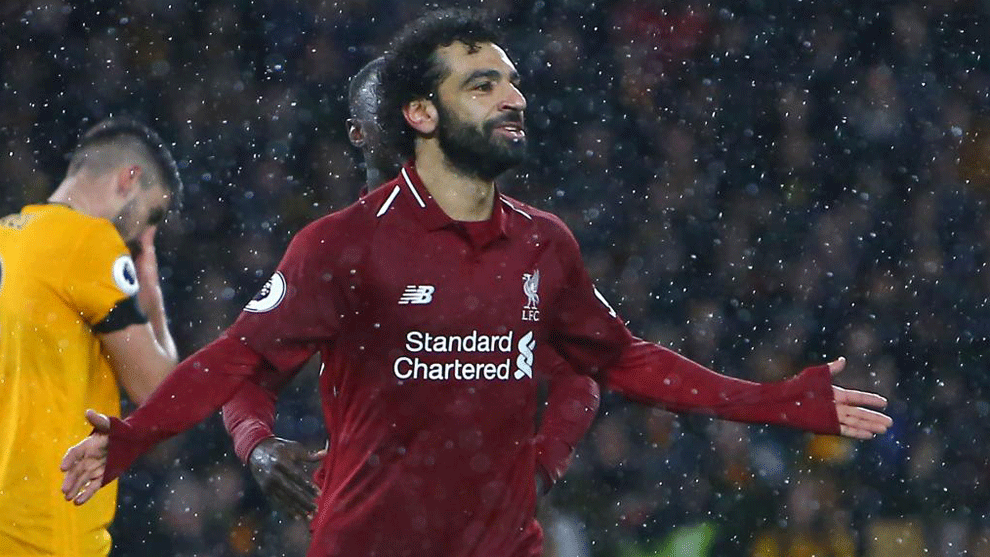 Salah celebrates after scoring the opening goal of the match between...
