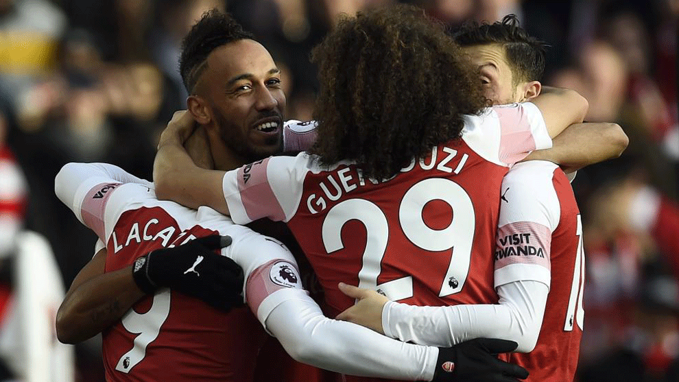 Aubameyang celebrates with teammates afters scoring against Burnley