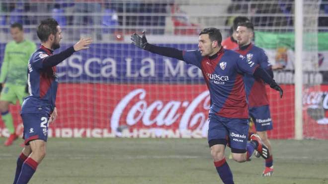 Huesca&apos;s players celebrate a goal.