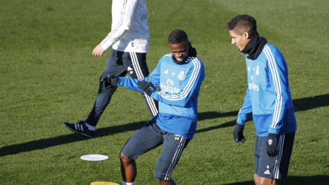 Vincius and Varane laugh during a Real Madrid training session.