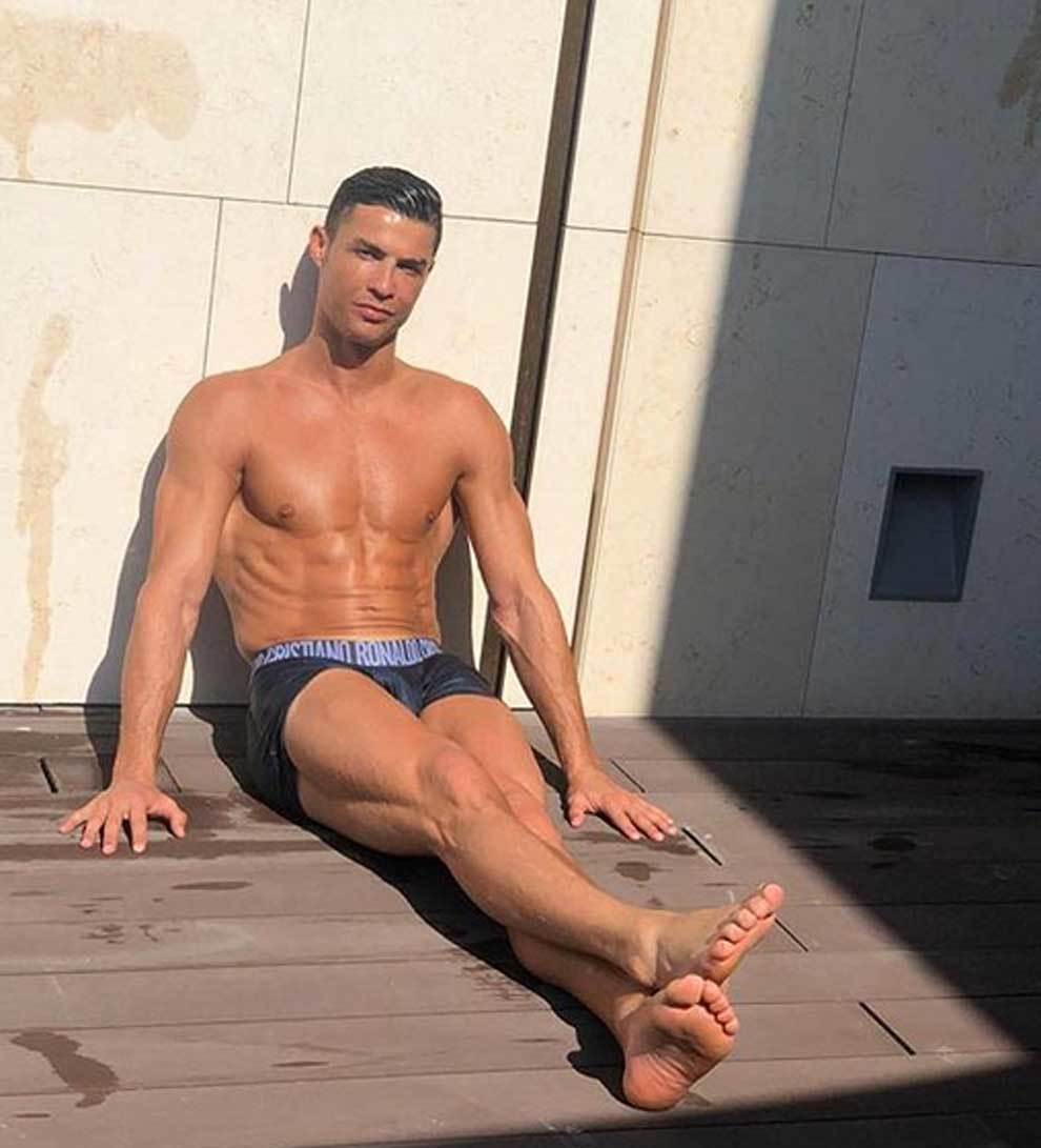Cristiano Ronaldo posed in a swimwear, showing off is six-pack. While...