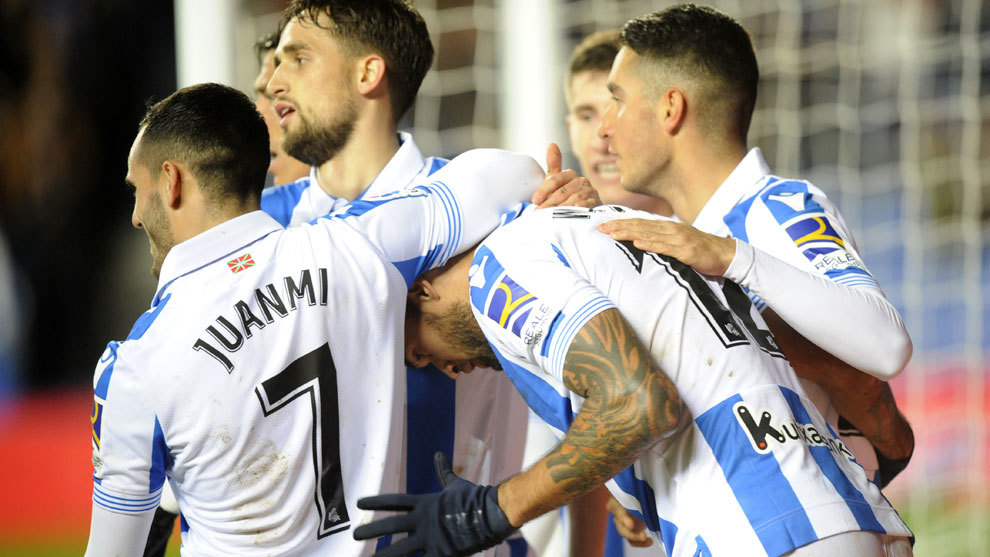 The Real Sociedad players celebrate one of their goals.