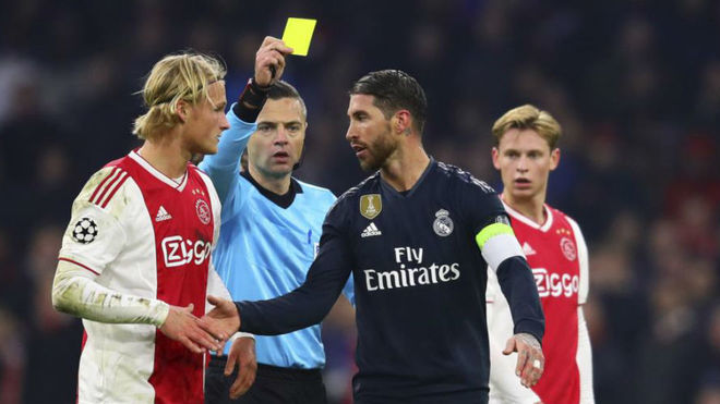 Ramos receiving the infamous yellow card during Ajax-Real Madrid this...