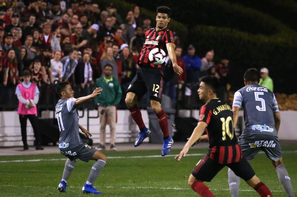 <HIT>Atlanta</HIT><HIT>United</HIT> defender Miles Robinson (C) jumps for the ball in the second half of the CONCACAF Champions League playoff football match between <HIT>Atlanta</HIT><HIT>United</HIT> and Herediano at the Fifth Third Bank Stadium on February 28, 2019, in Kennesaw, Georgia. (Photo by Elijah Nouvelage / AFP)