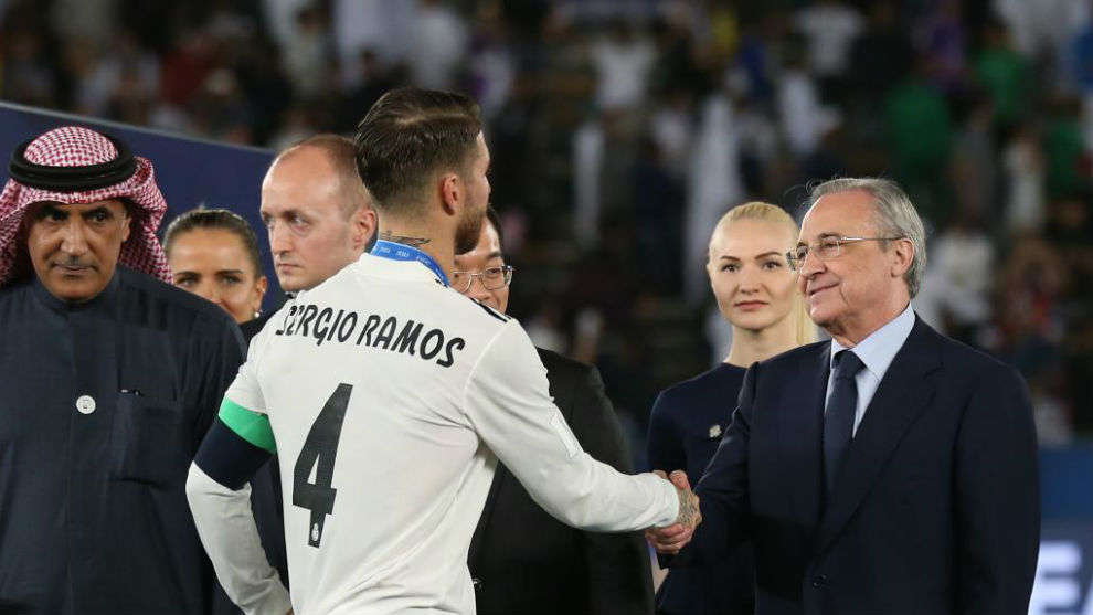 Ramos and Florentino shaking hands after the Club World Cup.