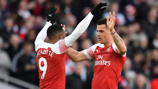 Lacazette and Xhaka celebrate one of the goals.