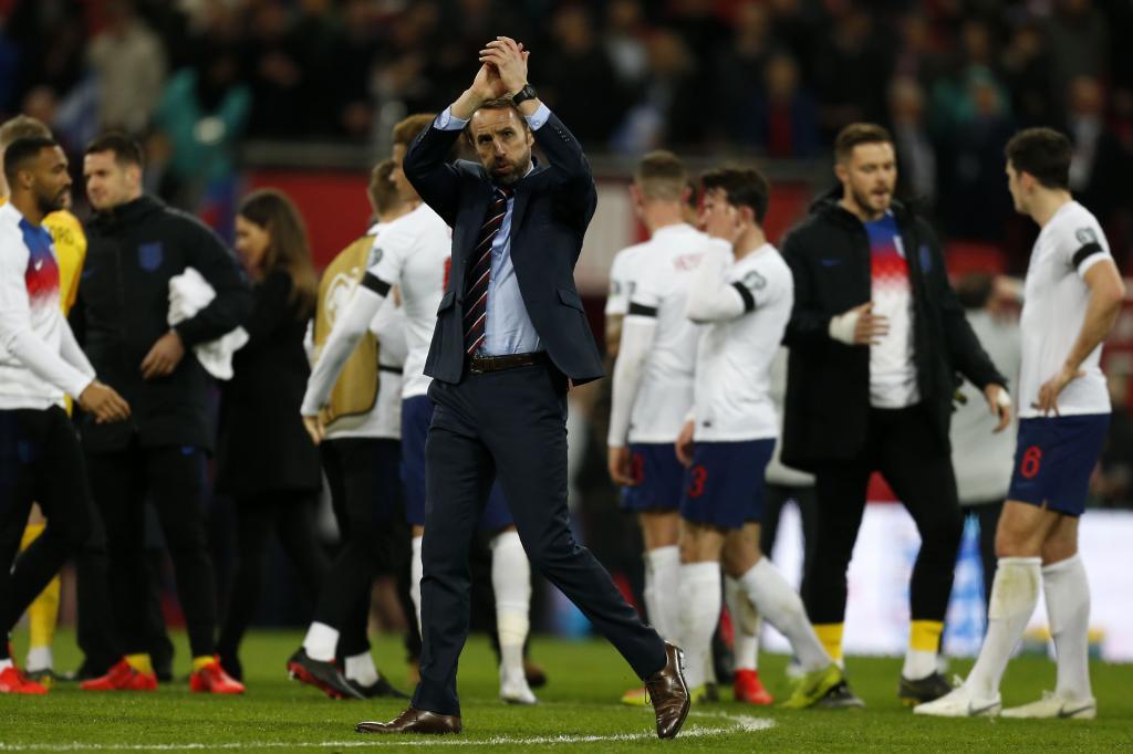 <HIT>England</HIT>s manager Gareth Southgate (C) applauds supporters on the pitch after the UEFA Euro 2020 Group A qualification football match between <HIT>England</HIT> and Czech Replublic at Wembley Stadium in London on March 22, 2019. - <HIT>England</HIT> won the game 5-0. (Photo by Ian KINGTON / AFP) / NOT FOR MARKETING OR ADVERTISING USE / RESTRICTED TO EDITORIAL USE