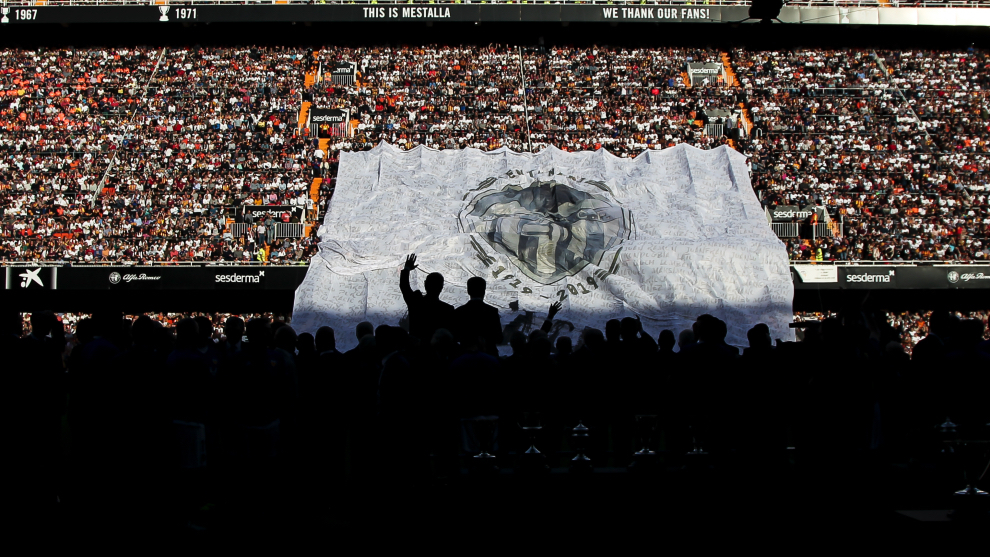 Spectacular backlit image of the Valencia players with supporters sat...