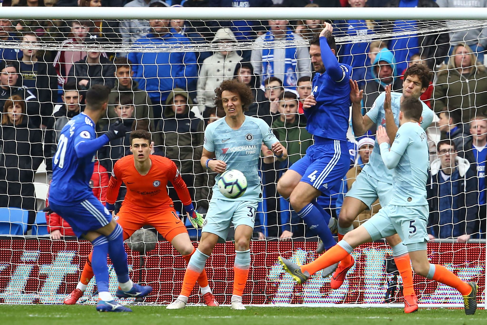 Cardiff Citys Spanish midfielder Vctor <HIT>Camarasa</HIT> (L) shoots to score the opening goal of the English Premier League football match between between Cardiff City and Chelsea at Cardiff City Stadium in Cardiff, south Wales on March 31, 2019. (Photo by Geoff CADDICK / AFP) / RESTRICTED TO EDITORIAL USE. No use with unauthorized audio, video, data, fixture lists, club/league logos or live services. Online in-match use limited to 120 images. An additional 40 images may be used in extra time. No video emulation. Social media in-match use limited to 120 images. An additional 40 images may be used in extra time. No use in betting publications, games or single club/league/player publications. /