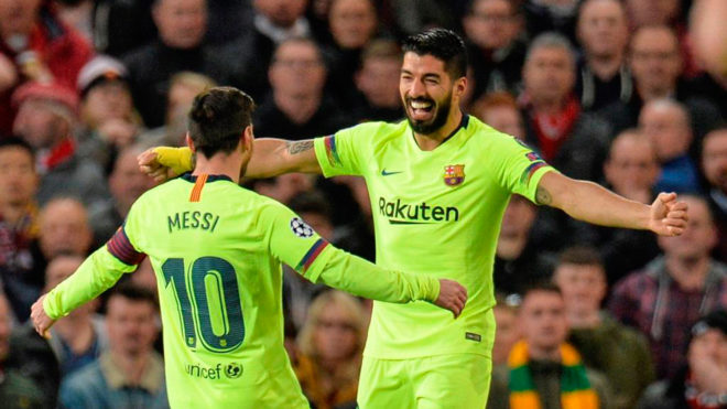 Messi and Surez celebrate at Old Trafford.