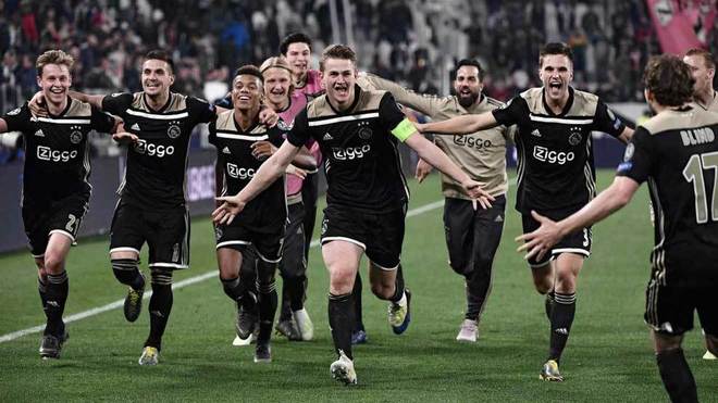 The Ajax players celebrate reaching the Champions League semi-finals.