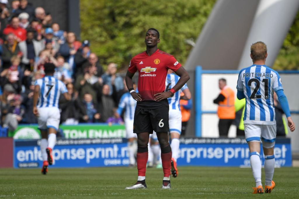 Manchester Uniteds French midfielder Paul <HIT>Pogba</HIT> (C) reacts after Huddersfield score their first goal during the English Premier League football match between Huddersfield Town and Manchester United at the John Smiths stadium in Huddersfield, northern England on May 5, 2019. (Photo by Paul ELLIS / AFP) / RESTRICTED TO EDITORIAL USE. No use with unauthorized audio, video, data, fixture lists, club/league logos or live services. Online in-match use limited to 120 images. An additional 40 images may be used in extra time. No video emulation. Social media in-match use limited to 120 images. An additional 40 images may be used in extra time. No use in betting publications, games or single club/league/player publications. /