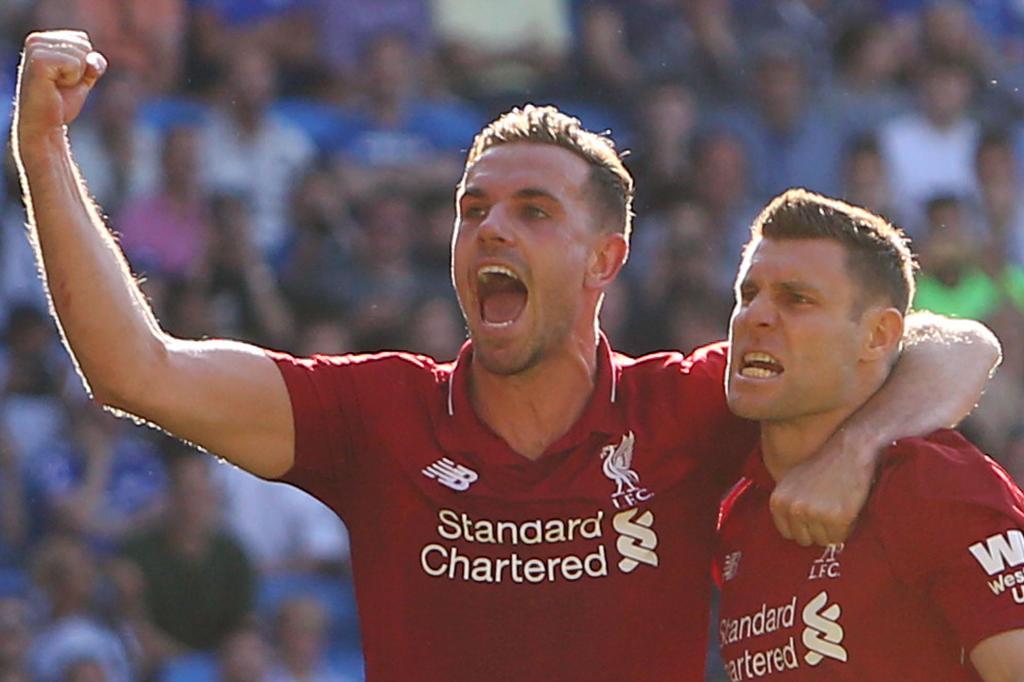 Henderson y Milner celebran un gol.