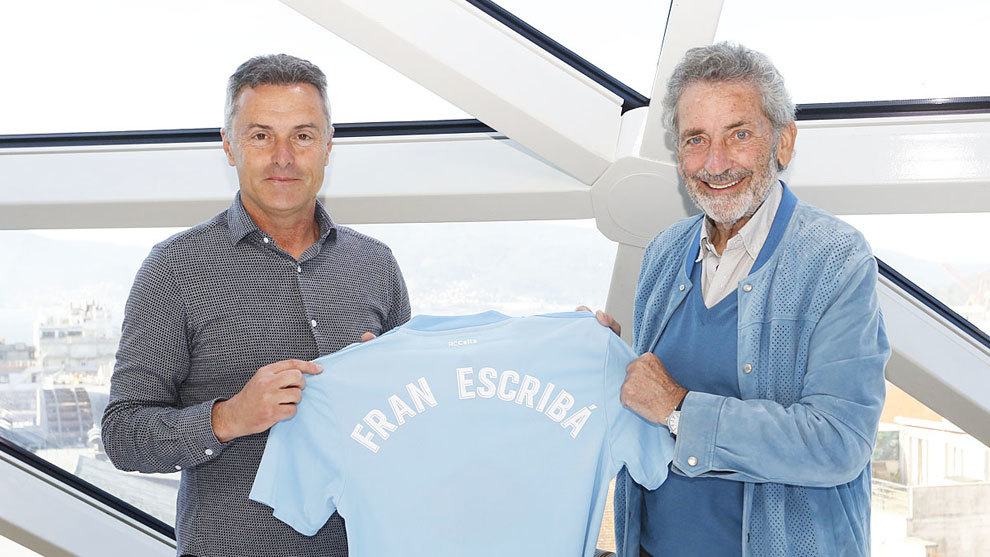 Fran Escriba posing with Celta&apos;s shirt alongside club president Carlos...
