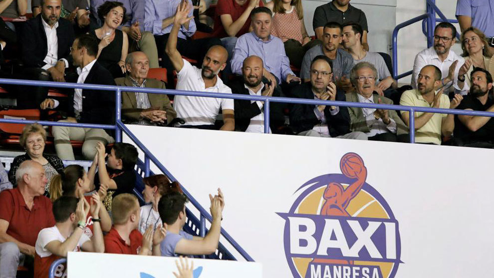 Pep Guardiola waves to fans during Manresa-Real Madrid.
