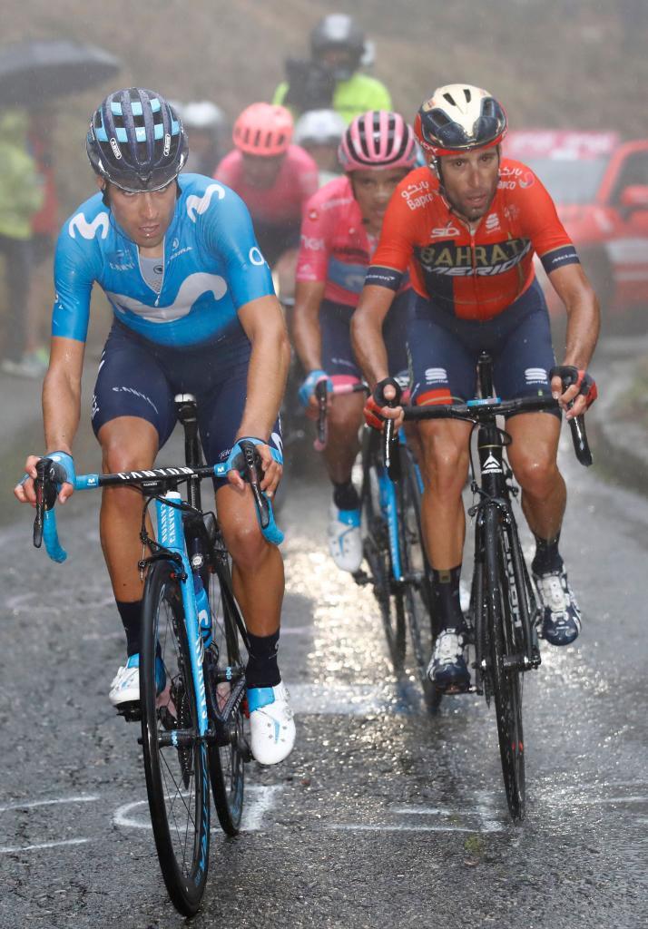 Team Movistar rider Spains Mikel <HIT>Landa</HIT> (L), climbs followed by Team Bahrain rider Italys Vincenzo Nibali (R) and Team Movistar Ecuadorian Richard Carapaz wearing the overall leaders pink jersey, during the stage sixteen of the 102nd Giro dItalia - Tour of Italy - cycle race, 226kms from Lovere to Ponte Di Legno on May 28, 2019. (Photo by Luk BENIES / AFP)