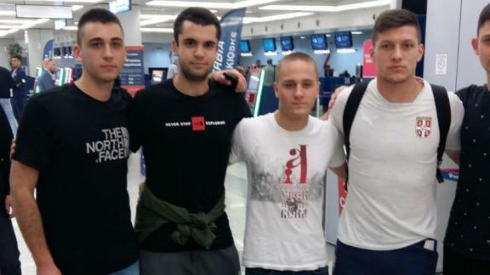 Luka Jovic poses for a photo with a group of fans at Belgrade Airport.