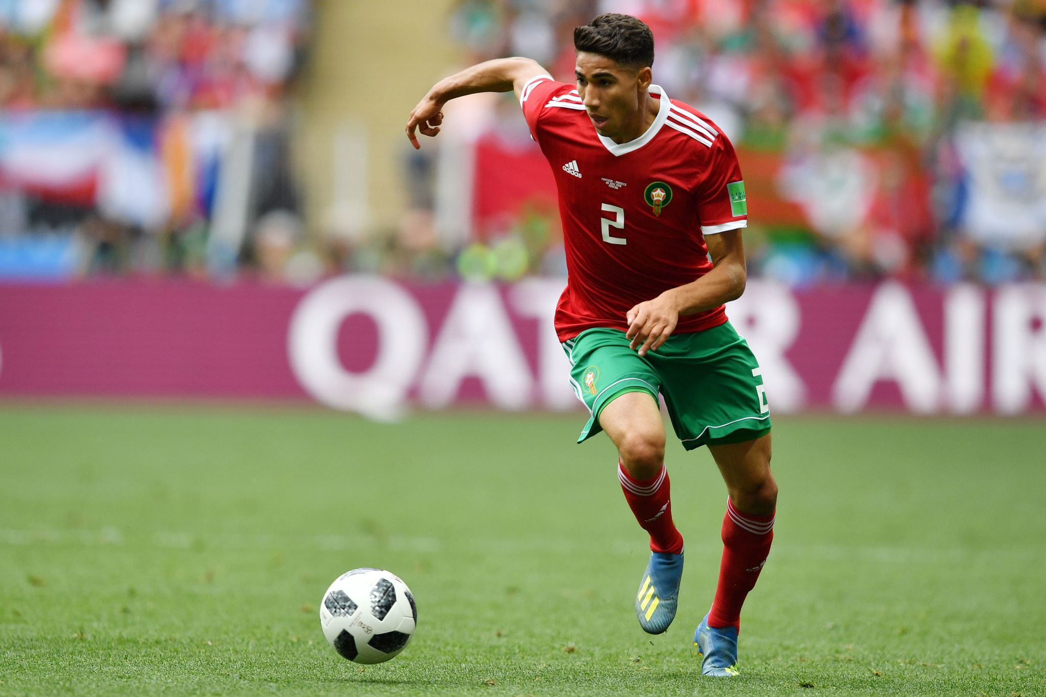 Moroccos defender <HIT>Achraf</HIT> Hakimi runs with the ball during the Russia 2018 World Cup Group B football match between Portugal and Morocco at the Luzhniki Stadium in Moscow on June 20, 2018. / AFP PHOTO / Yuri CORTEZ / RESTRICTED TO EDITORIAL USE - NO MOBILE PUSH ALERTS/DOWNLOADS