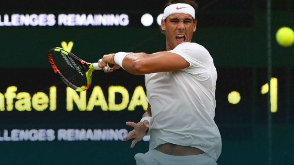 Rafa Nadal hitting a left-handed shot.