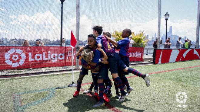 The Barcelona players celebrate a goal.