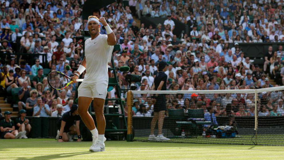 Rafa Nadal celebrates winning a point.