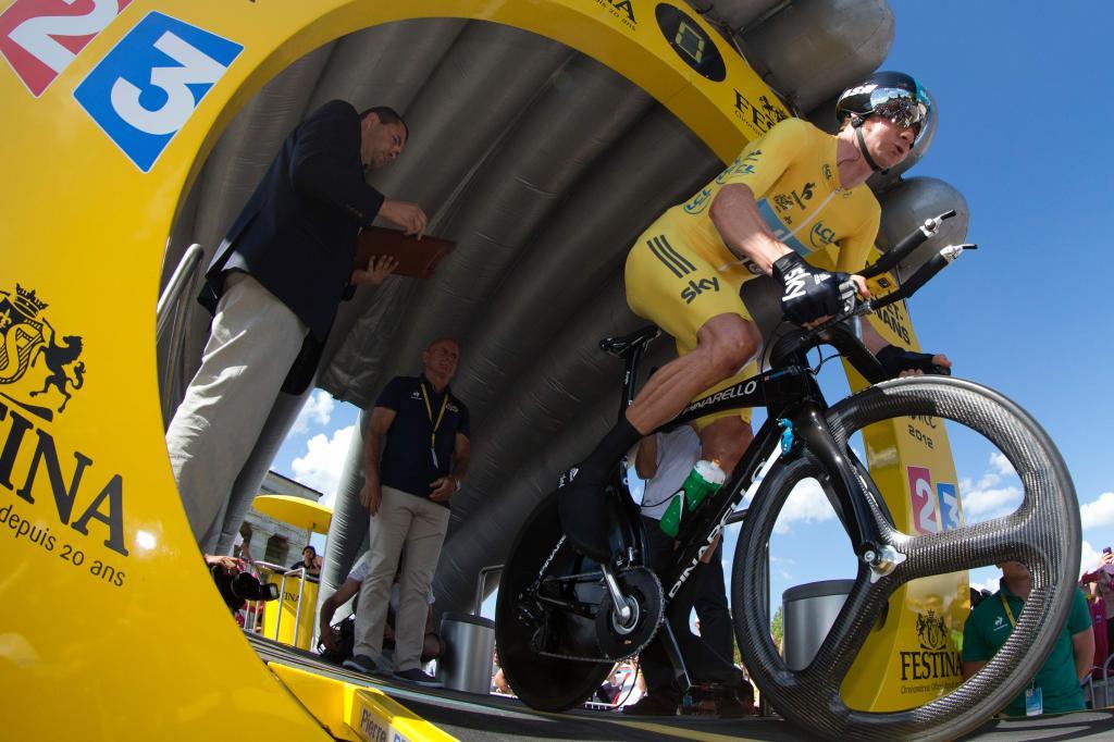 (FILES) This file photo taken on July 09, 2012 shows Stage winner, Overall leaders yellow jersey, British Bradley <HIT>Wiggins</HIT>, competing at the beginning of the 41,5 km individual time-trial and ninth stage of the 2012 Tour de France cycling race starting in Arc-et-Senans and finishing in Besancon, eastern France, on July 9, 2012. AFP PHOTO / JOEL SAGET Bradley <HIT>Wiggins</HIT> announced his retirement from professional cycling on December 28, 2016, bringing the curtain down on a career that saw him become one of Britains greatest sportsmen. The 36-year-old became Britains first Tour de France winner in 2012 and bows out with eight Olympic medals, including five golds, and seven world titles, across track and road cycling, to his name. / AFP PHOTO / JOEL SAGET