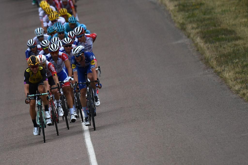 The pack rides during the seventh stage of the 106th edition of the <HIT>Tour</HIT> de France cycling race between Belfort and Chalon-sur-Saone, on July 12, 2019. (Photo by Anne-Christine POUJOULAT / AFP)