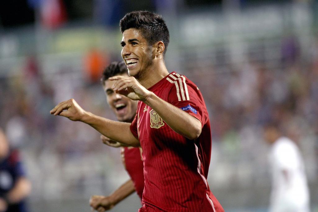 Marco Asensio of Spain celebrates after scoring during the UEFA 2015 European U-19 Championship semi-final match between France and Spain at Municipal Stadium in <HIT>Katerini</HIT>, Greece, on July 16, 2015. AFP PHOTO / STRINGER