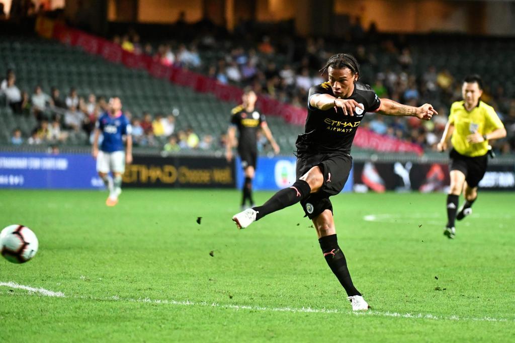 Manchester Citys Leroy <HIT>Sane</HIT> shoots to score a goal during the friendly football match between English Premier League club Manchester City and Hong Kong side Kitchee at Hong Kong Stadium on July 24, 2019. (Photo by Anthony WALLACE / AFP)