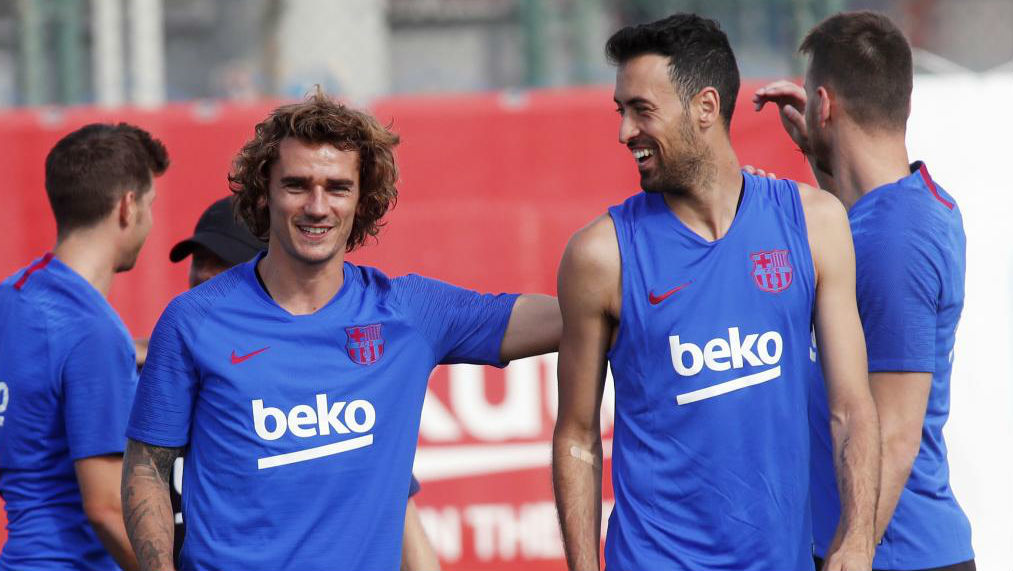 Antoine Griezmann and Sergio Busquets during a Barcelona training...