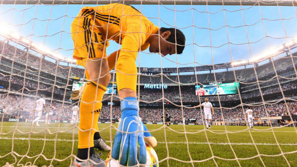 Courtois picks the ball out of the net in New Jersey.