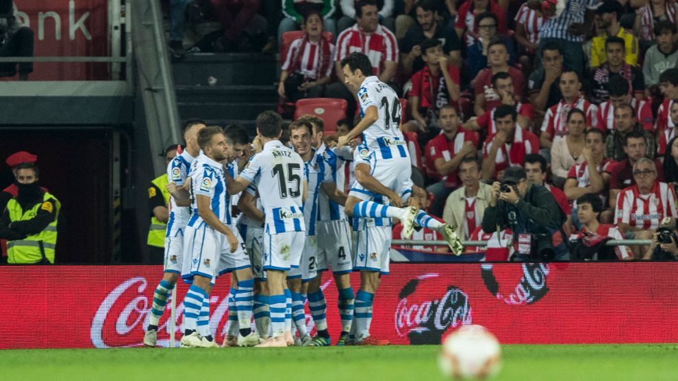 Real Sociedad&apos;s players celebrate one of their goals in the 3-1 derby...