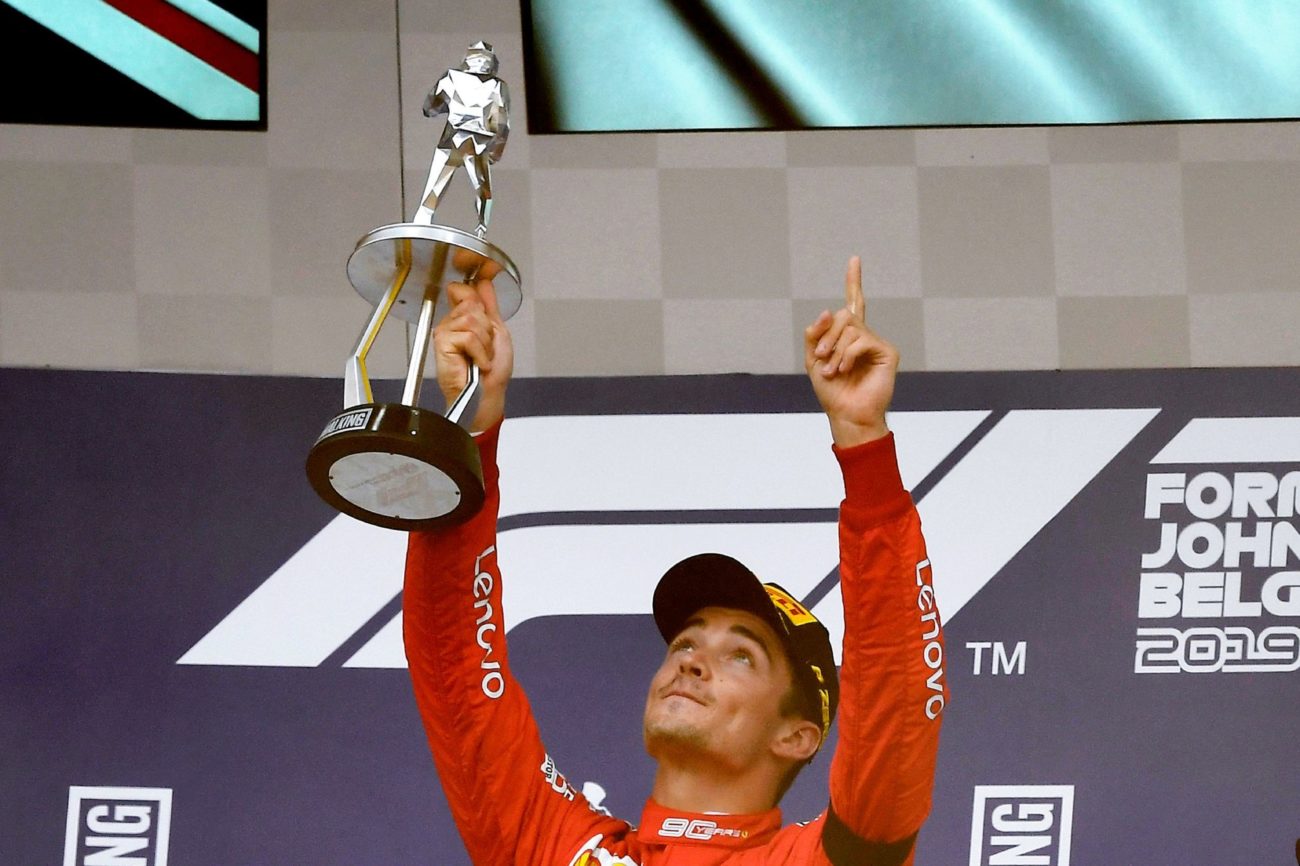Winner Ferraris Monegasque driver Charles Leclerc holds...