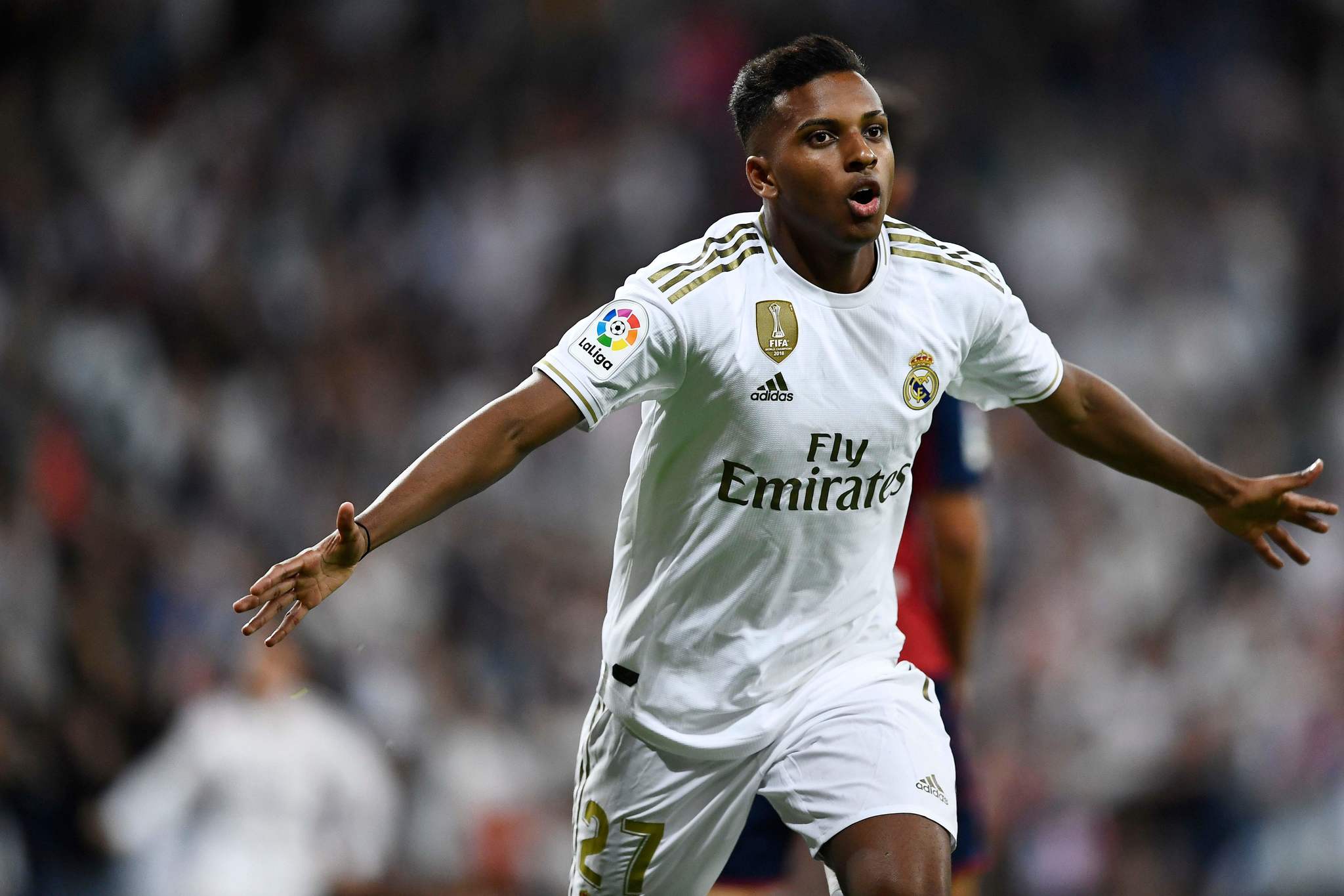 Real Madrids Brazilian forward <HIT>Rodrygo</HIT> celebrates his goal during the Spanish league football match between Real Madrid CF and CA Osasuna at the Santiago Bernabeu stadium in Madrid, on September 25, 2019. (Photo by OSCAR DEL POZO / AFP)