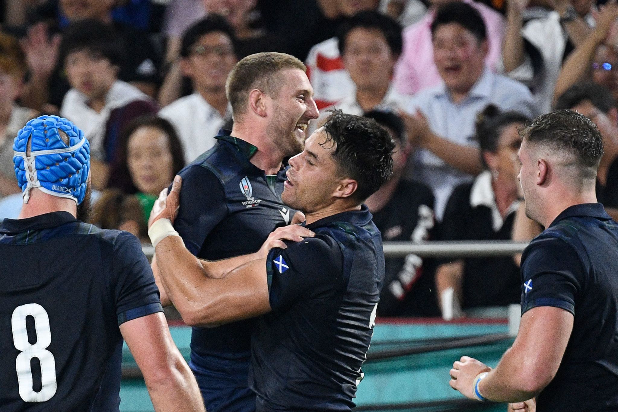 <HIT>Scotland</HIT>s wing Sean Maitland (2R) celebrates with <HIT>Scotland</HIT>s fly-half Finn Russell (2L) after scoring a try during the Japan 2019 Rugby World Cup Pool A match between <HIT>Scotland</HIT> and Samoa at the Kobe Misaki Stadium in Kobe on September 30, 2019. (Photo by Filippo MONTEFORTE / AFP)