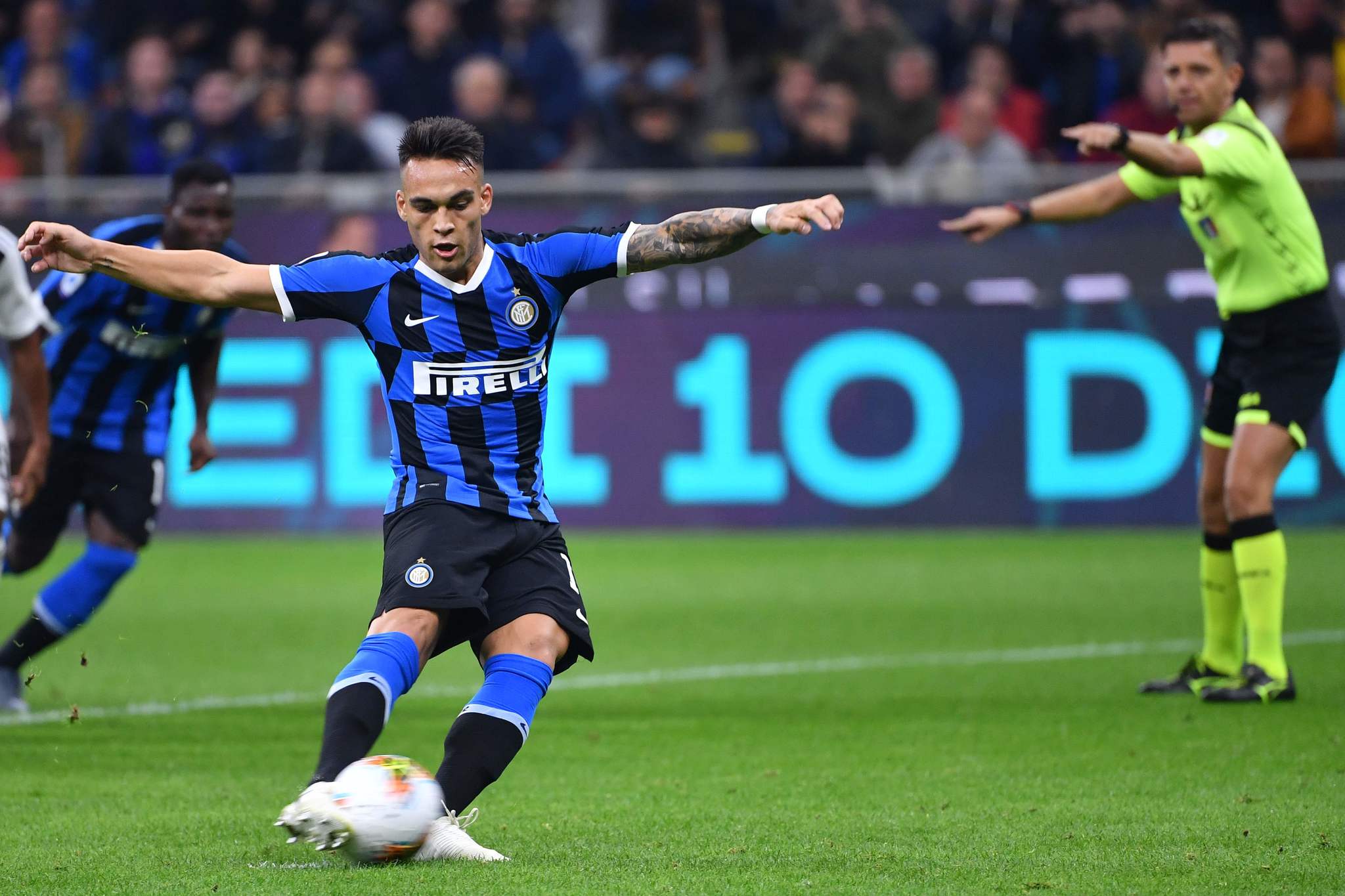 Inter Milans Argentinian forward <HIT>Lautaro</HIT><HIT>Martinez</HIT> shoots to score a penalty during the Italian Serie A football match Inter vs Juventus on October 6, 2019 at the San Siro stadium in Milan. (Photo by Alberto PIZZOLI / AFP)