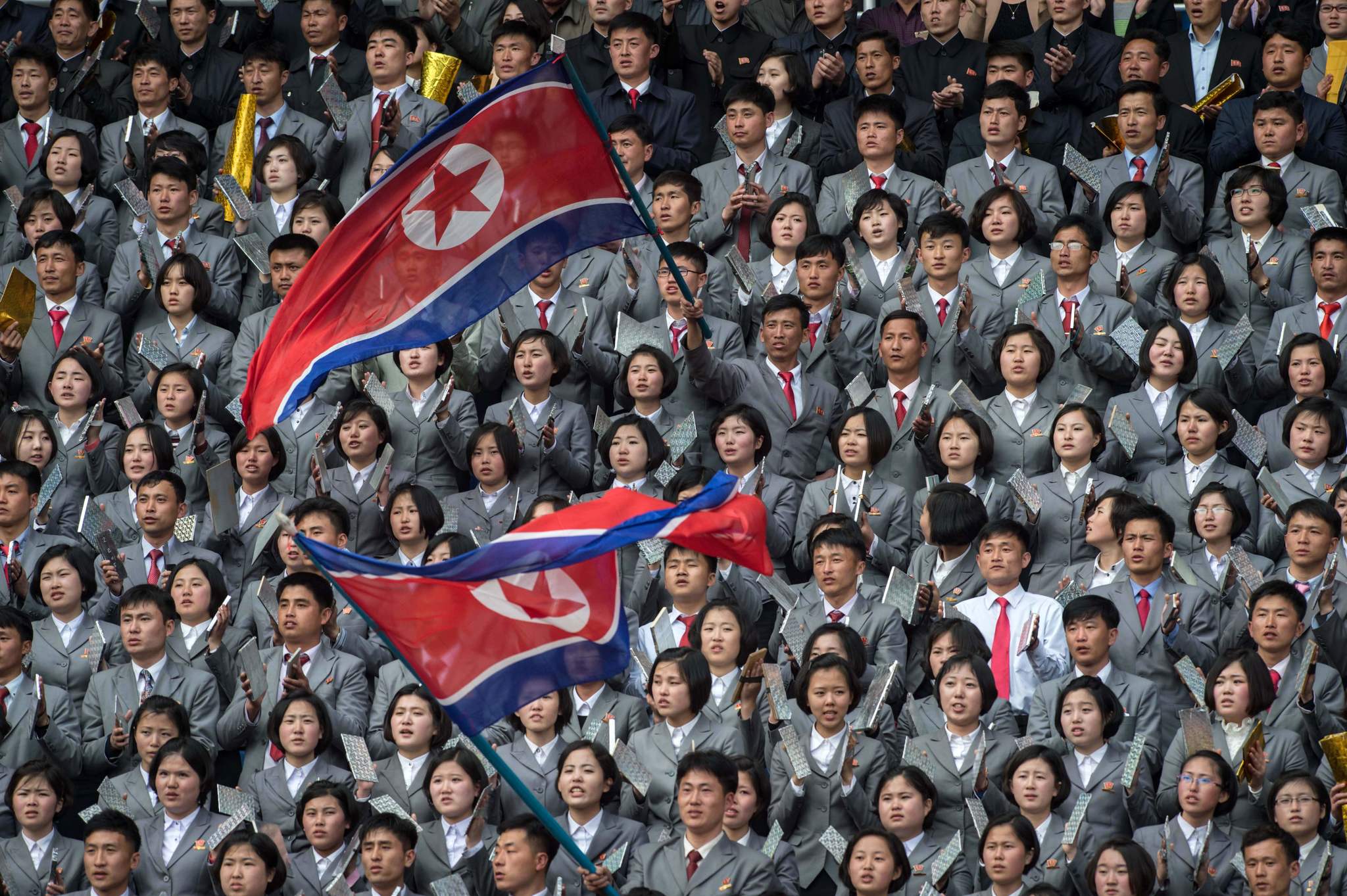 (FILES) In a file photo taken on April 7, 2017 <HIT>North</HIT><HIT>Korea</HIT> fans wave flags as they support their team against South <HIT>Korea</HIT> during their AFC Womens 2018 Asian Cup Group B qualifying football match at the Kim Il-Sung stadium in Pyongyang. - <HIT>North</HIT> and South <HIT>Korea</HIT> face each other in a World Cup qualifier on October 15, 2019 for their first ever competitive mens match in Pyongyang, while talks on the <HIT>North</HIT>s nuclear arsenal remain deadlocked. (Photo by KIM WON-JIN / AFP) / TO GO WITH AFP STORY NKOREA-SKOREA-DIPLOMACY-FBL-KOR-PRK,ADVANCER BY SUNGHEE HWANG