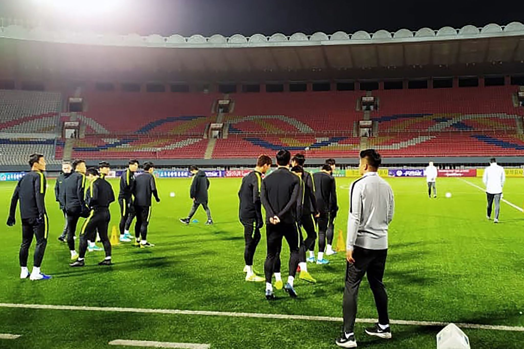 This handout photo taken on October 14, 2019 by the <HIT>Korea</HIT> Football Association (KFA) shows South Korean national football team players warming up during an official training session at Kim Il Sung Stadium in Pyongyang, ahead of the World Cup 2022 Qualifying Asian zone Group H football match between South <HIT>Korea</HIT> and <HIT>North</HIT><HIT>Korea.</HIT> - The teams -- with Tottenhams star forward Son Heung-min included in the South Korean squad -- are expected to face each other at the Kim Il Sung Stadium on October 15. This will be the first competitive mens game between the two sides to be held in Pyongyang, and has raised hopes for new momentum in ties between the two <HIT>Koreas</HIT>. (Photo by Handout / KFA / AFP) / RESTRICTED TO EDITORIAL USE - MANDATORY CREDIT "AFP PHOTO / KFA" - NO MARKETING NO ADVERTISING CAMPAIGNS - DISTRIBUTED AS A SERVICE TO CLIENTS == NO ARCHIVE
