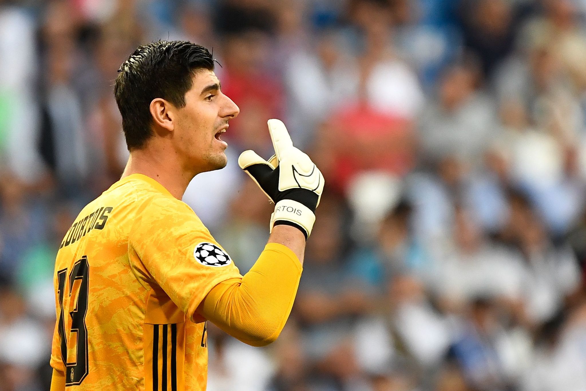 Real Madrids Belgian goalkeeper Thibaut <HIT>Courtois</HIT> reacts during the UEFA Champions league Group A football match between Real Madrid and Club Brugge at the Santiago Bernabeu stadium in Madrid on October 1, 2019. (Photo by PIERRE-PHILIPPE MARCOU / AFP)