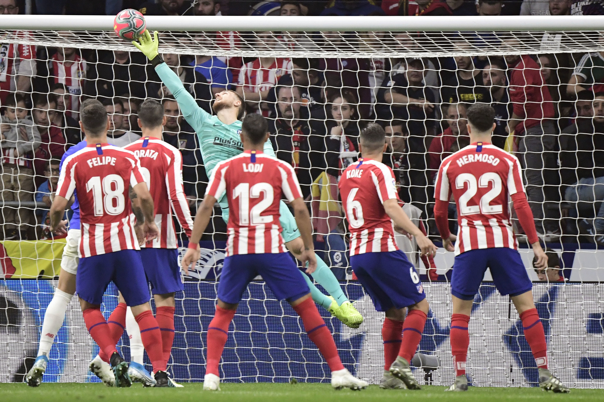 Atletico Madrids Slovenian goalkeeper Jan <HIT>Oblak</HIT> dives to clear the ball during the Spanish league football match between Club Atletico de Madrid and Athletic Club Bilbao at the Wanda Metropolitano stadium in Madrid on October 26, 2019. (Photo by JAVIER SORIANO / AFP)